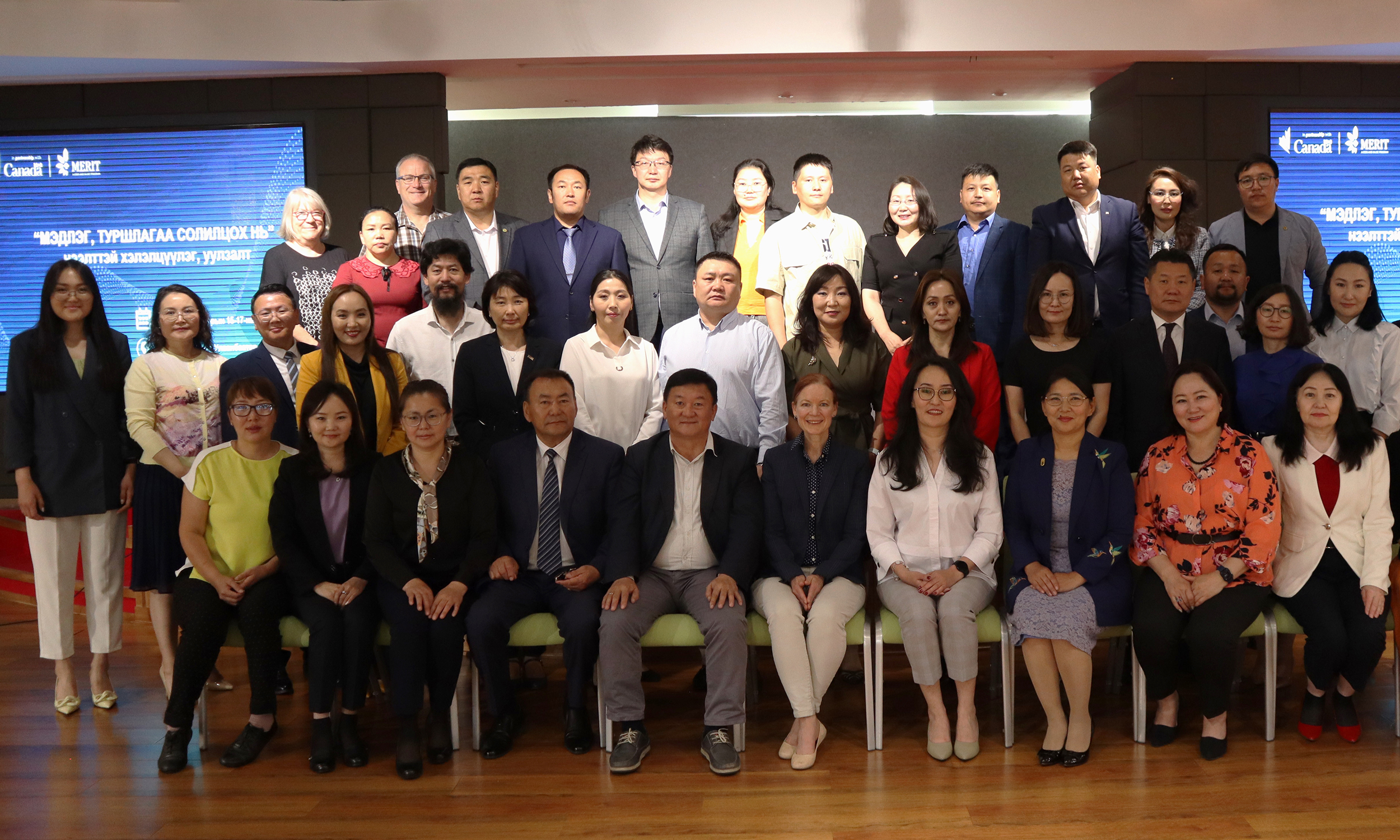 A large group photo of participants from a learning series in Mongolia