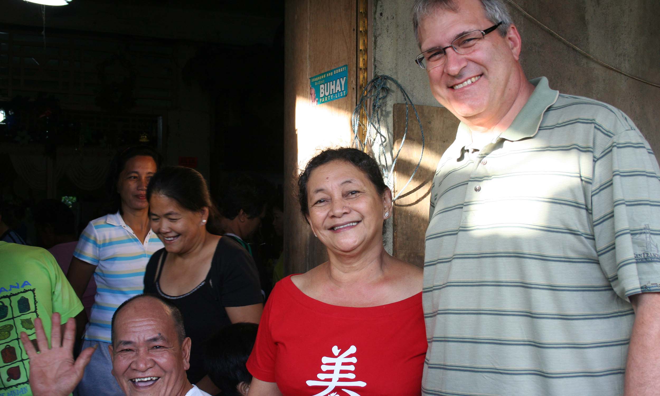 A woman and woman stand side by side in a room in the Philippines